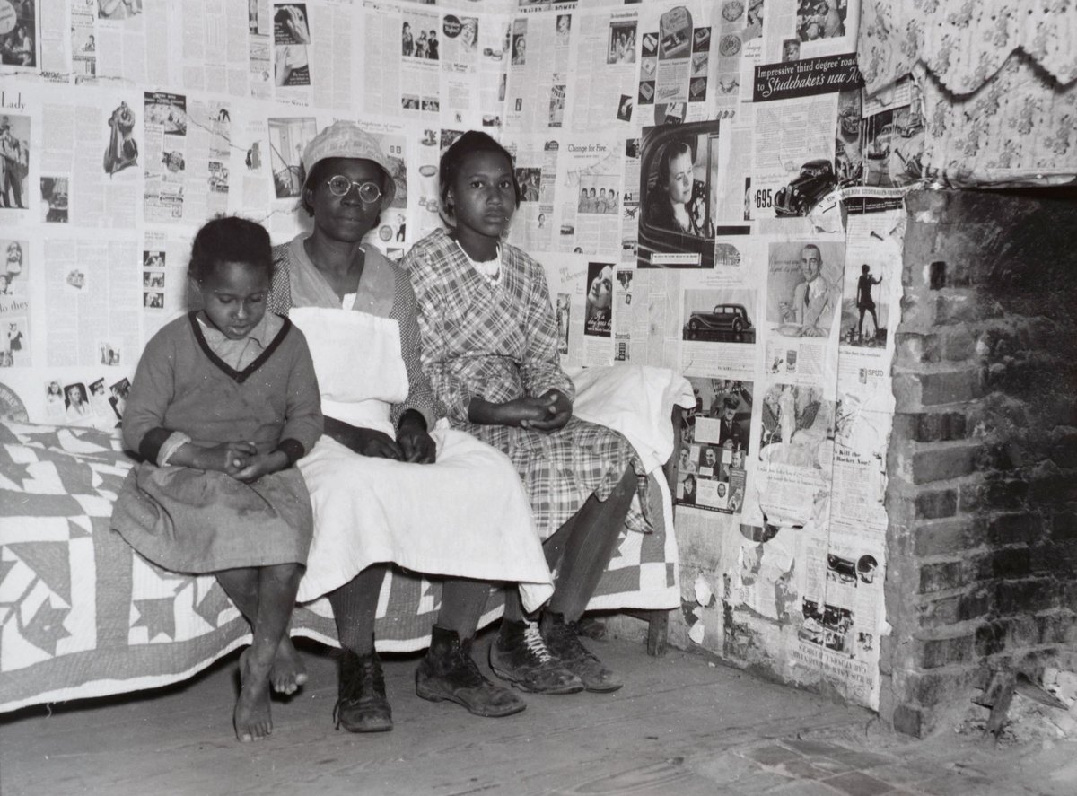 Gee's Bend artist Lucy Mooney and granddaughters Lucy P. Pettway and Bertha Pettway on a bed in Lucy’s house, Gee’s Bend, Alabama, 1937 Arthur Rothstein. Farm Security Administration/Office of War Information Collection, Prints and Photographs Division, Library of Congress.