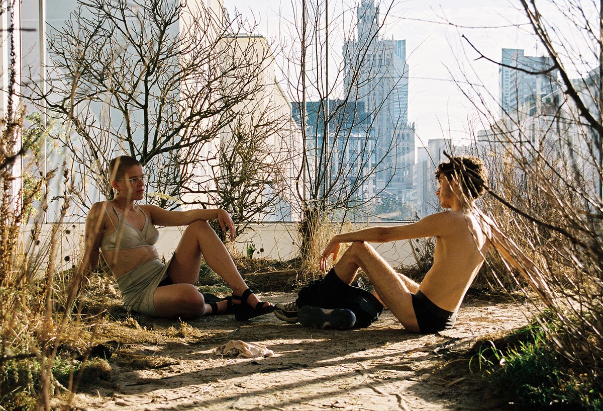Alex Baczynski-Jenkins's performance Until a thousand roses bloom (with Warsaw in the background, 2018) Courtesy of the artist and Foksal Gallery Foundation, Warsaw. Photo: Spyros Rennt