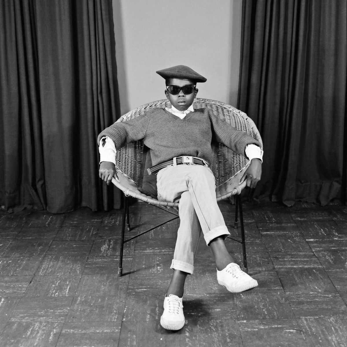 S.J. Moodley, Boy in a wicker chair, from the series Portraits
from Kitty’s Studio, around 1978 Promised gift of the Walther Family Foundation. © The S. J. Moodley Family