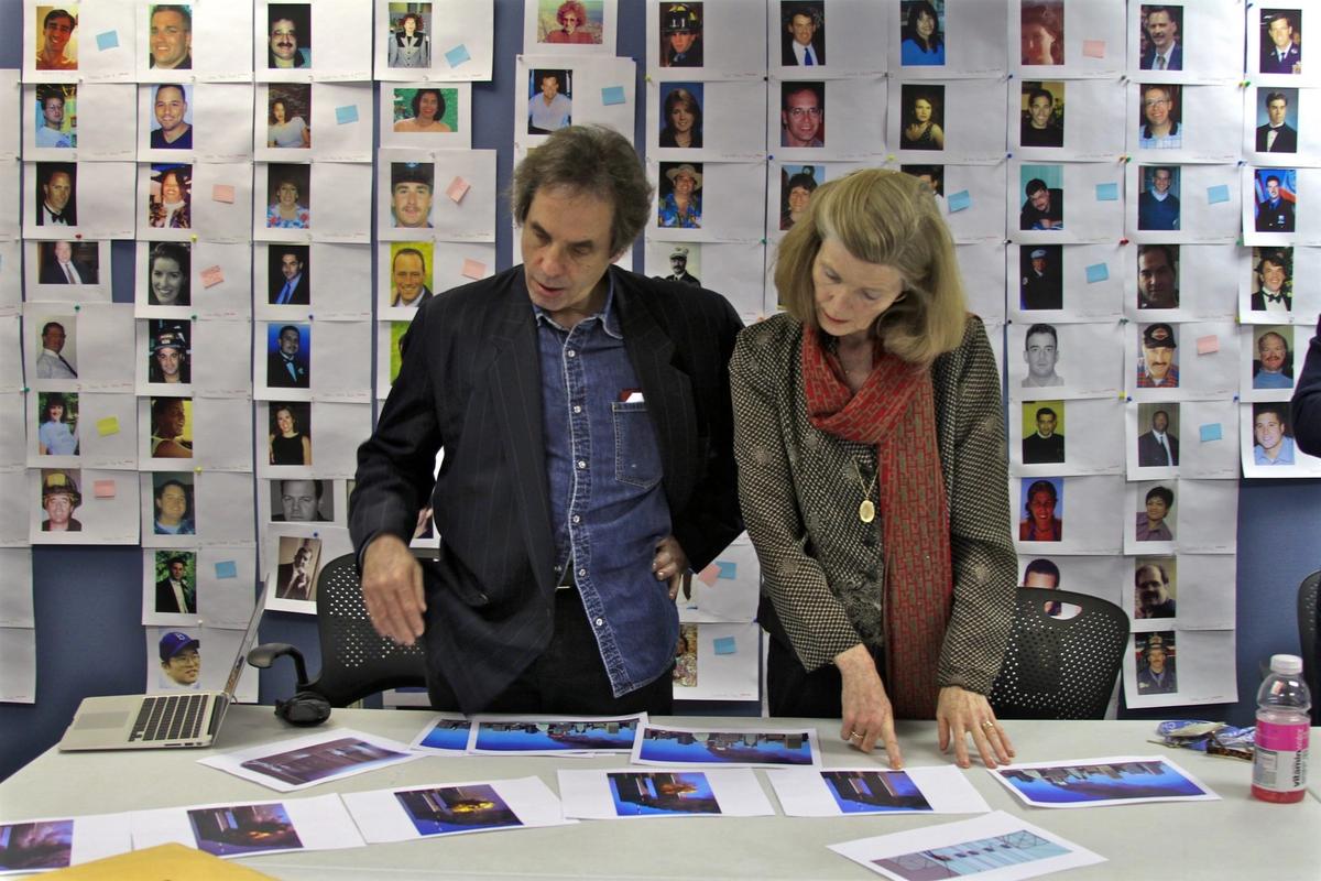 Michael Shulan, Creative Director, and Jan Seidler Ramirez/ Chief Curator & Director of Collections, Nation September 11th Memorial and Museum, reviews photographs of victims that will be included in the Memorial