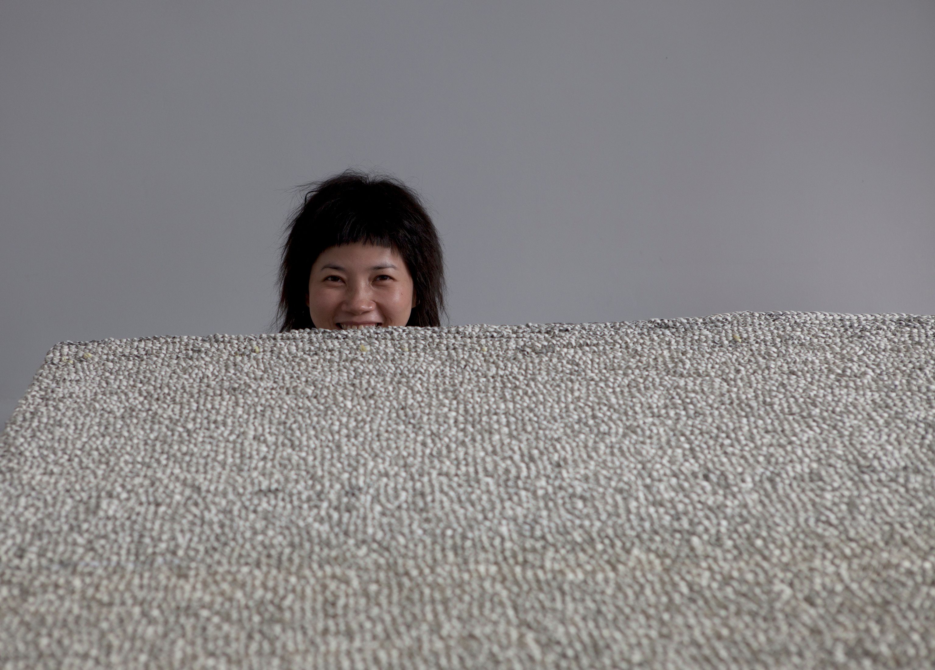 Chen has spent decades perfecting her technique of weaving shreds of paper with knitting needles © Clément Ledermann