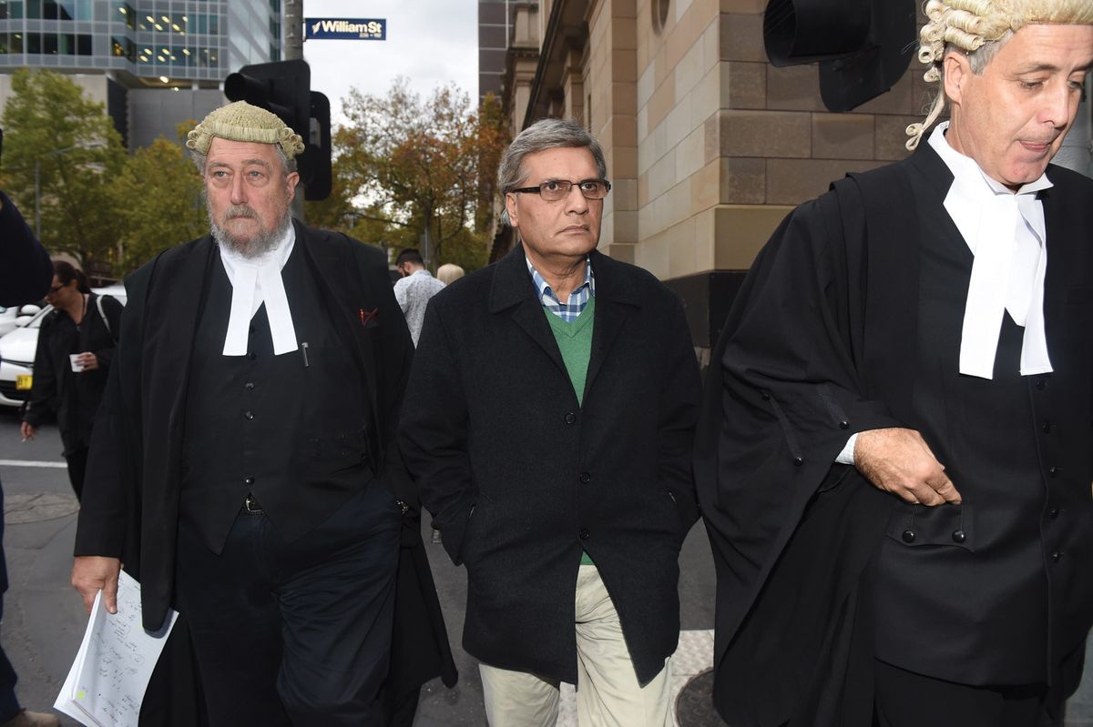 Art restorer Mohamed Aman Siddique (centre), pictured in May 2016 leaving the Victorian Supreme Court in Melbourne, where he was found guilty of art fraud, but later acquitted © TRACEY NEARMY/AAP Image