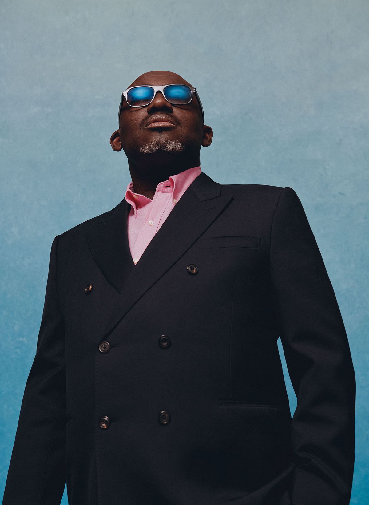 Edward Enninful wears a suit by Alexander McQueen; shirt, Polo Ralph Lauren; glasses, Cutler and Gross Photography by Nadine Ijewere; stylist Susan Bender Whitfield; stylist assistant Talitha Howden; makeup by Joshua Duncan; grooming by Ian Hoyos at Champs Barbers


