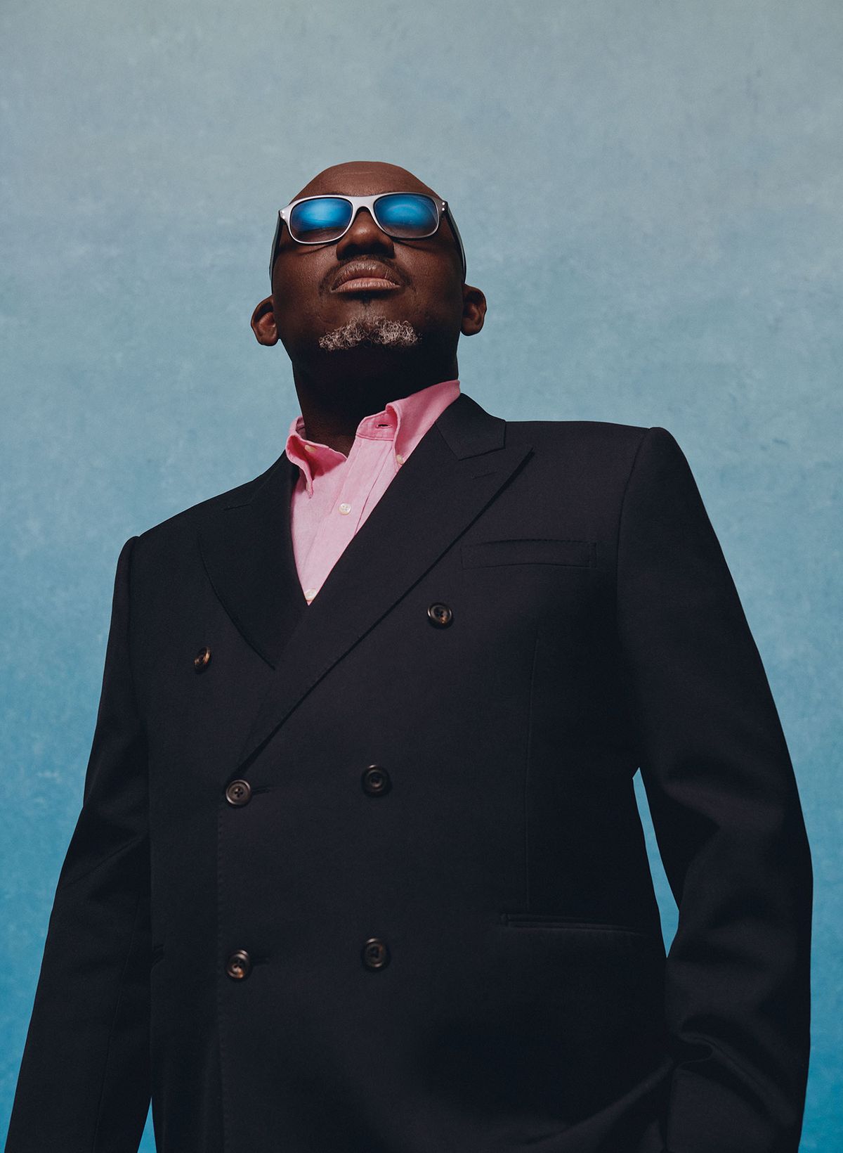 Edward Enninful wears a suit by Alexander McQueen; shirt, Polo Ralph Lauren; glasses, Cutler and Gross Photography by Nadine Ijewere; stylist Susan Bender Whitfield; stylist assistant Talitha Howden; makeup by Joshua Duncan; grooming by Ian Hoyos at Champs Barbers