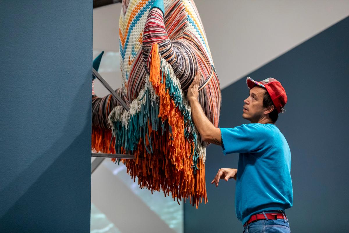 Cannupa Hanska Luger in the Joslyn's Temporary Exhibition Galleries
Photograph by Shayla Blatchford (Diné), 2025



