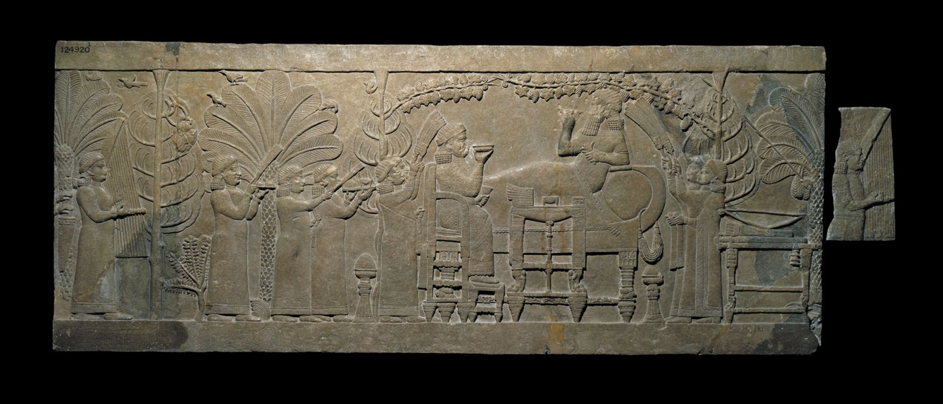 The Banquet Scene relief from the North Palace of Ashurbanipal, Nineveh, Iraq (around 645 BC) is widely regarded as the world's finest single relief panel from Assyria © The Trustees of the British Museum