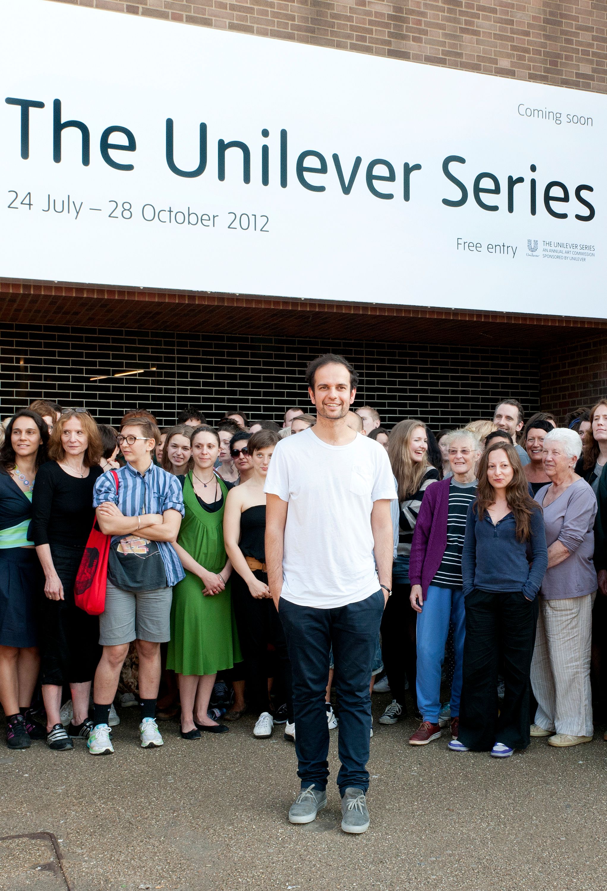 Tino Sehgal at Tate Modern with his interpreters for These associations, 2012 Photo: courtesy of Gabrielle Fonseca Johnson, Tate Photography 2012