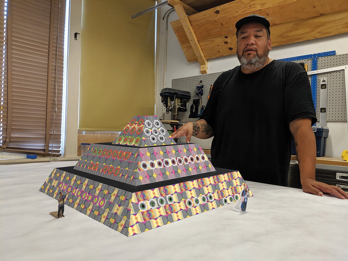 Choctaw-Cherokee artist Jeffrey Gibson with a model of Because Once You Enter My House It Becomes Our House (2020) Courtesy of the artist and Socrates Sculpture Park