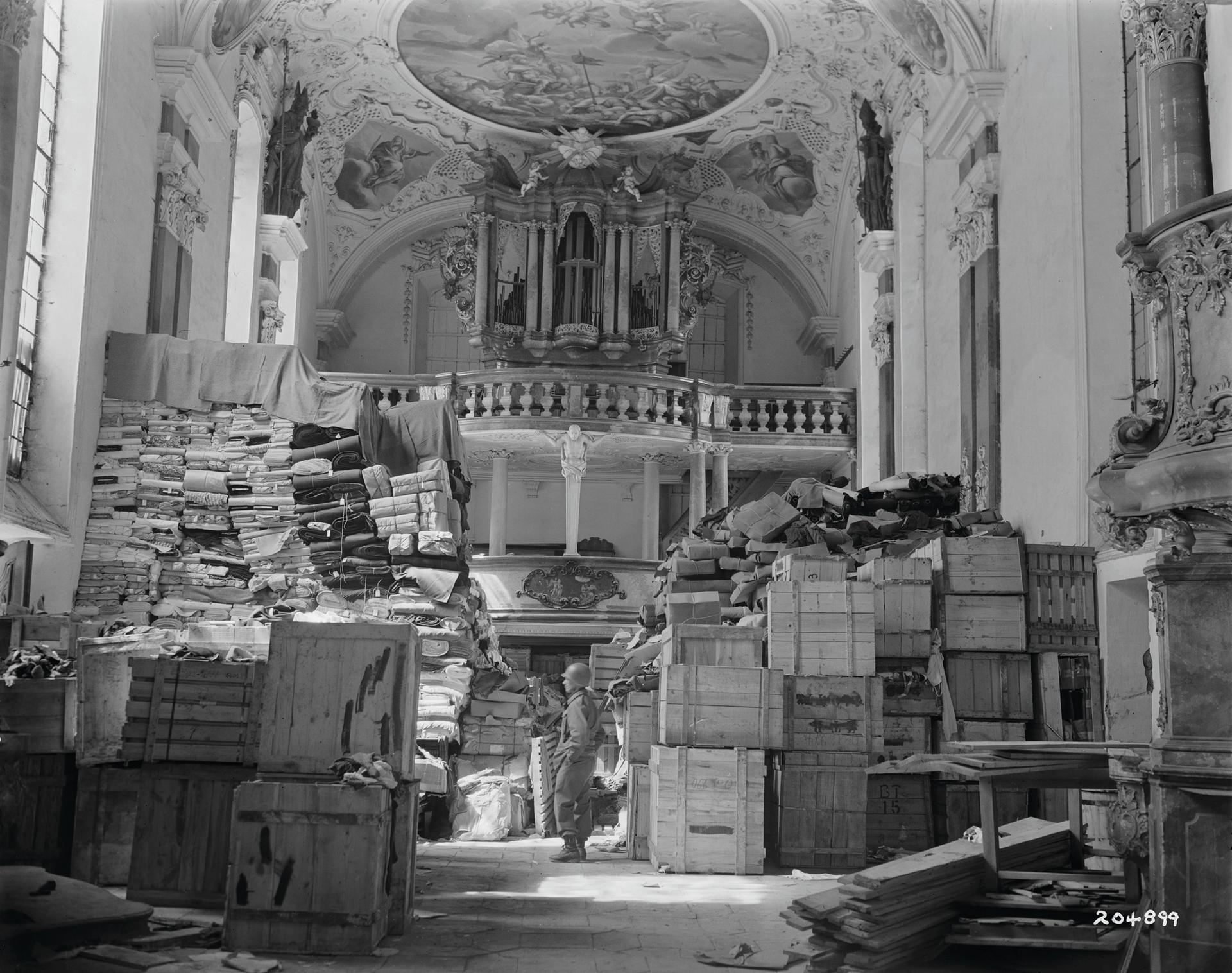 US troops find art and objects looted by the Nazis in a Bavarian church at the end of the Second World War © US National Archives