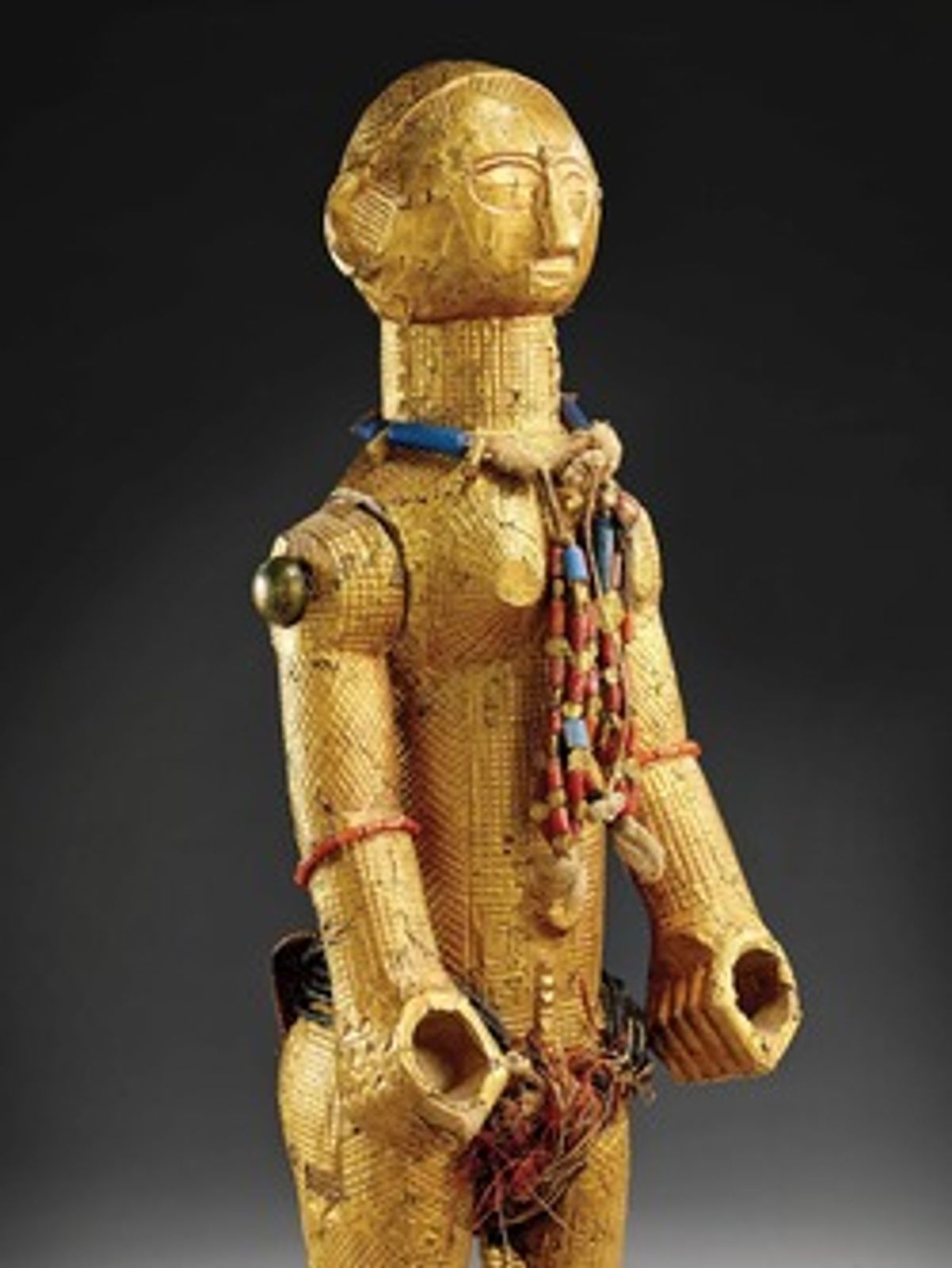 This 19th-century female figure from the current-day Ivory Coast is made of wood, gold, brass, coral, glass, coconut, vegetable fibres and cotton (© Musée du quai Branly - Jacques Chirac, photo Claude Germain)