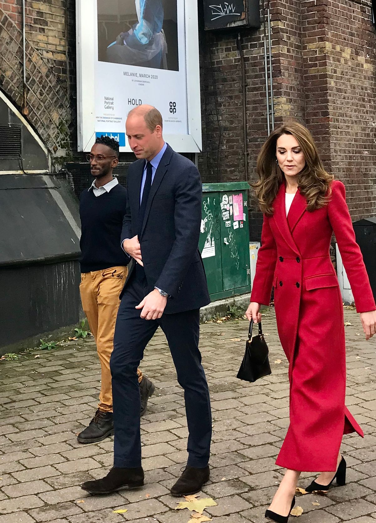 The Duke and Duchess of Cambridge with PhD student and volunteer Sami Massalami Ayad 