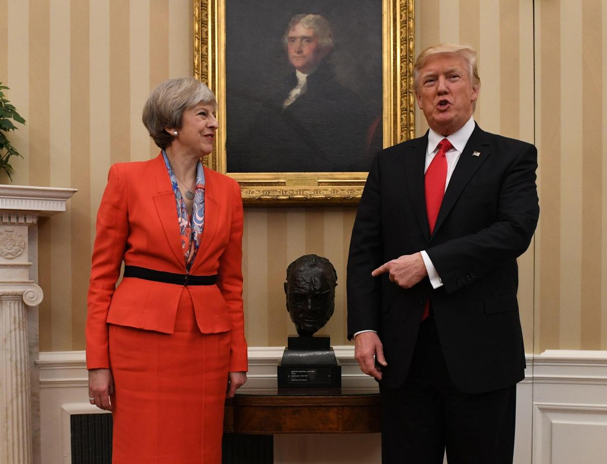 Donald Trump points to the bust of Winston Churchill in the Oval Office during his first presidency, after it was reportedly returned to the White House by Theresa May (left), then the UK prime minister 
PA Images / Alamy Stock Photo