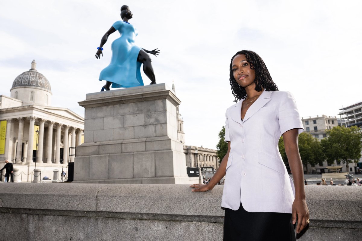The artist Tschabalala Self with her Fourth Plinth commission Lady in Blue in on Trafalgar Square, London Photo: Jeff Spicer / PA Media Assignments