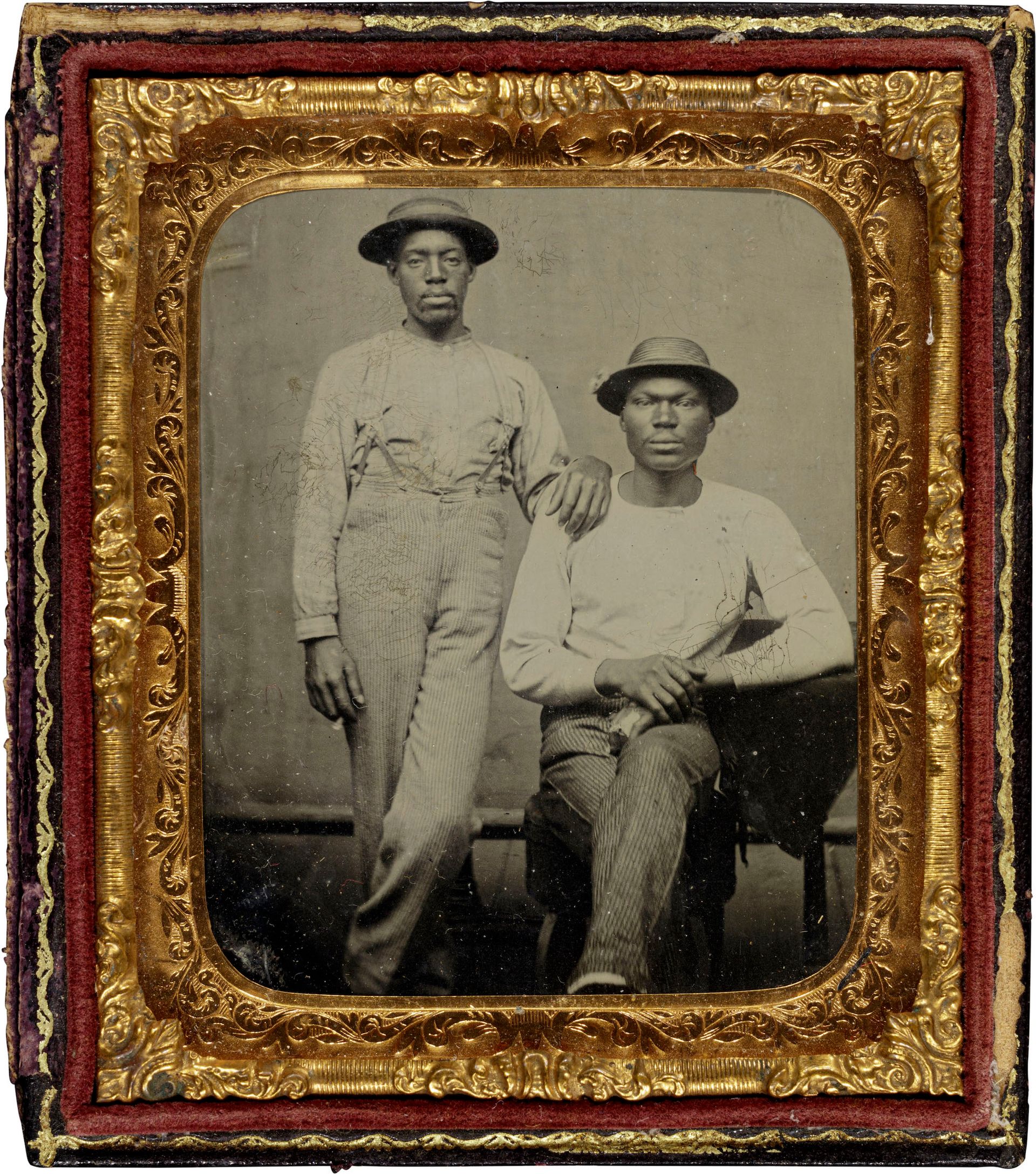 Unidentified photographer, [Untitled] (Two Men in Work Clothes, Wearing Hats, One Standing, One Seated), around 1880, tintype New Orleans Museum of Art, Gift of Stanley B. Burns, MD