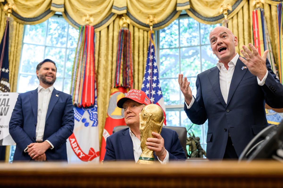 Game plan: US President Donald Trump, with Vice President J.D. Vance (left) and Fifa President Gianni Infantino at The White House with the famous World Cup globe trophy Photo: Daniel Torok/The White House