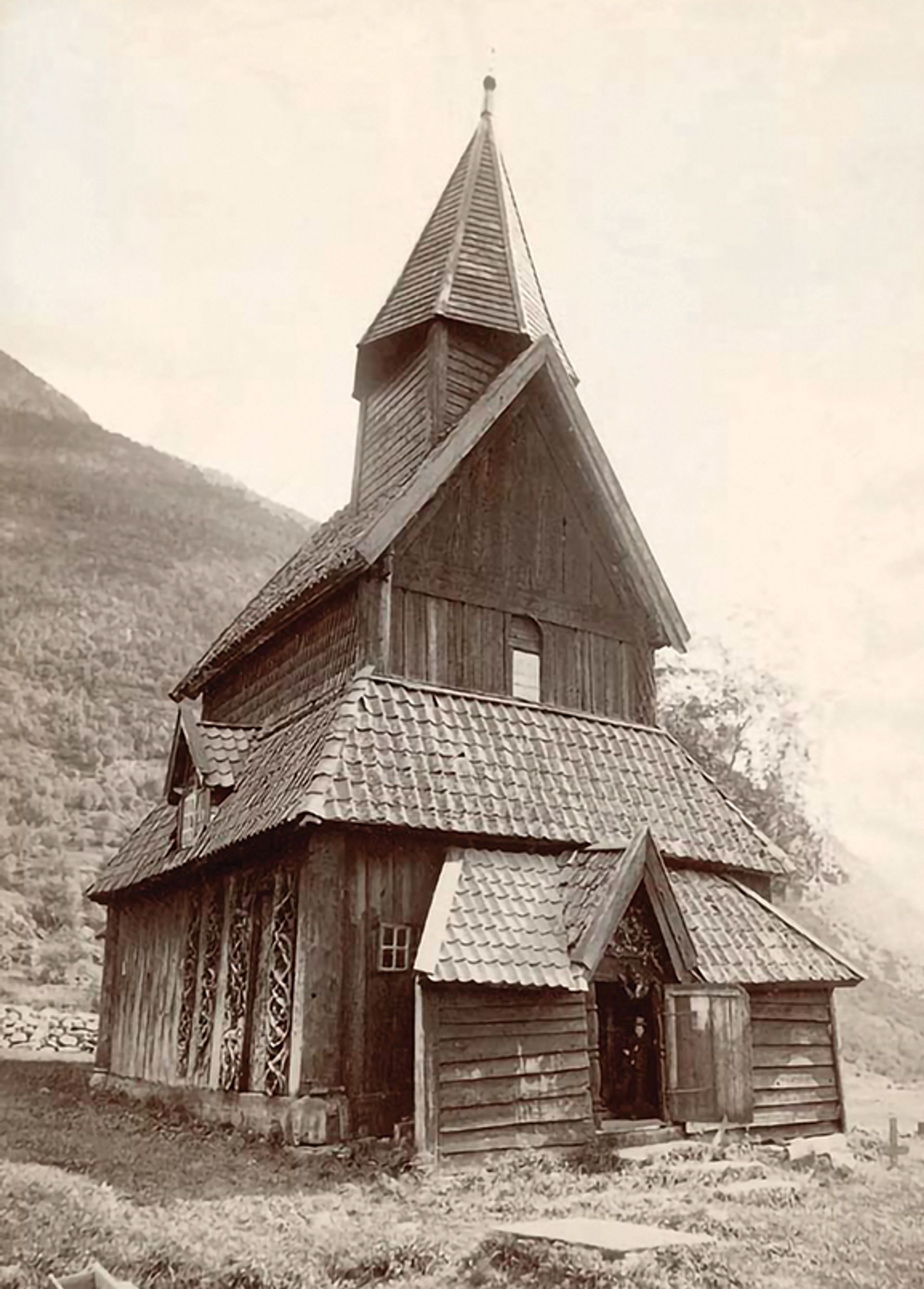 Urnes church in around 1890, showing the ‘extraordinary’ reused carvings on the north exterior wall (lower left) Axel Lindahl