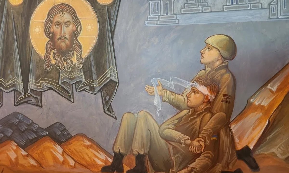 A painting of a Russian soldier treating a wounded Ukrainian has been seen hanging in a church in Russia: what does it mean?