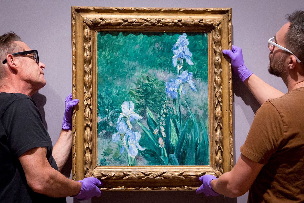 Workers hanging Caillebotte's Iris Bleus, Jardin du Petit Gennevilliers (around 1892) at the Art Gallery of Ontario Art Gallery of Ontario/Purchased with the assistance of a Moveable Cultural Property grant accorded by the Department of Canadian Heritage under the terms of the Cultural Property Export and Import Act; Acheté avec l'aide d'un subvention des biens culturels mobiliers accordée par le Ministère du Patrimoine canadien en vertu de la loi sur l'exportation et l'importation des biens culturels, 2019