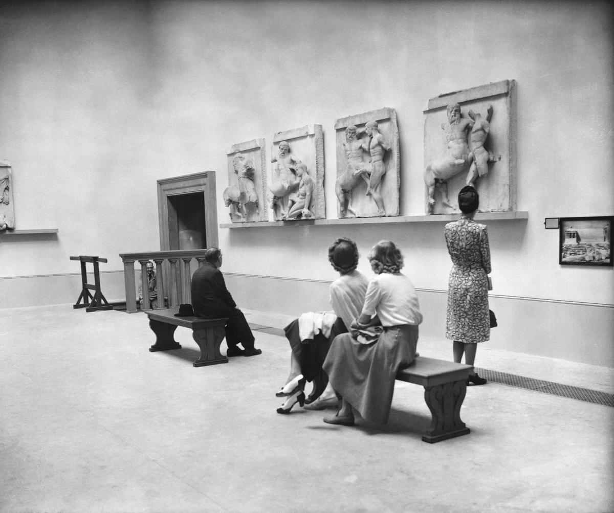 Visitors view the Parthenon Marbles at the British Museum in 1949 shortly after the opening of a new gallery to display them; the rooms housing the Marbles are due to reopen on 13 December after a year of closure partly due to a leaky roof. Photo: © Hulton-Deutsch Collection/Corbis via Getty Images.