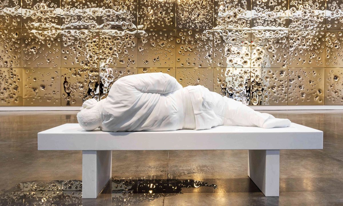 Maurizio Cattelan’s bullet-strewn gold installation in New York draws a connection between wealth and violence