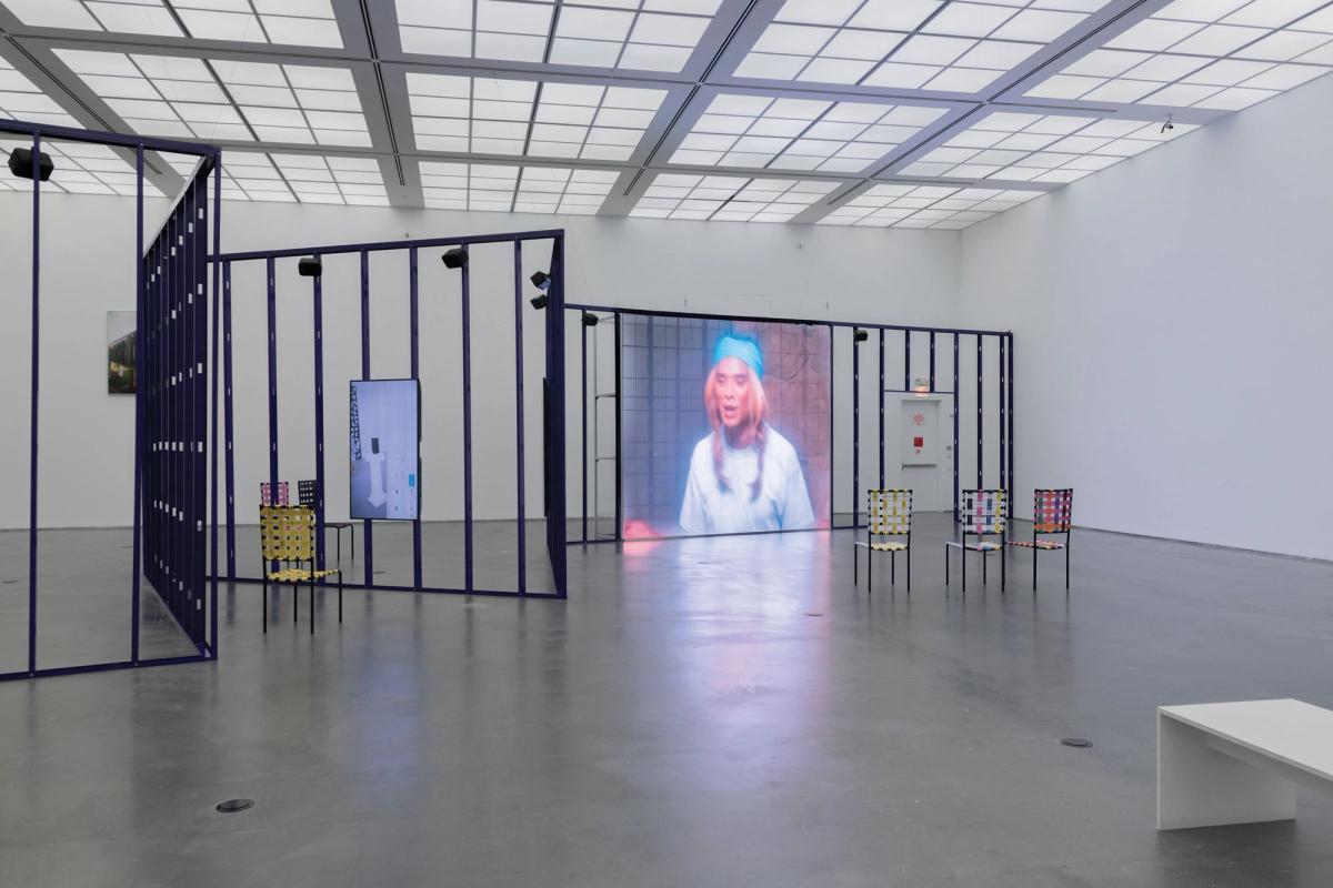 In the exhibition, Syms’s videos are shown on screens on a purple steel structure, with gaps to allow easy passage between the five episodes Photo: Nathan Keay; © MCA Chicago