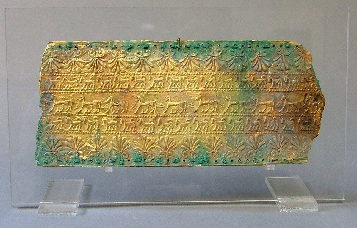 Etruscan fragment of gilt bronze sheet with embossed decoration of oriental motifs (seventh century BC)