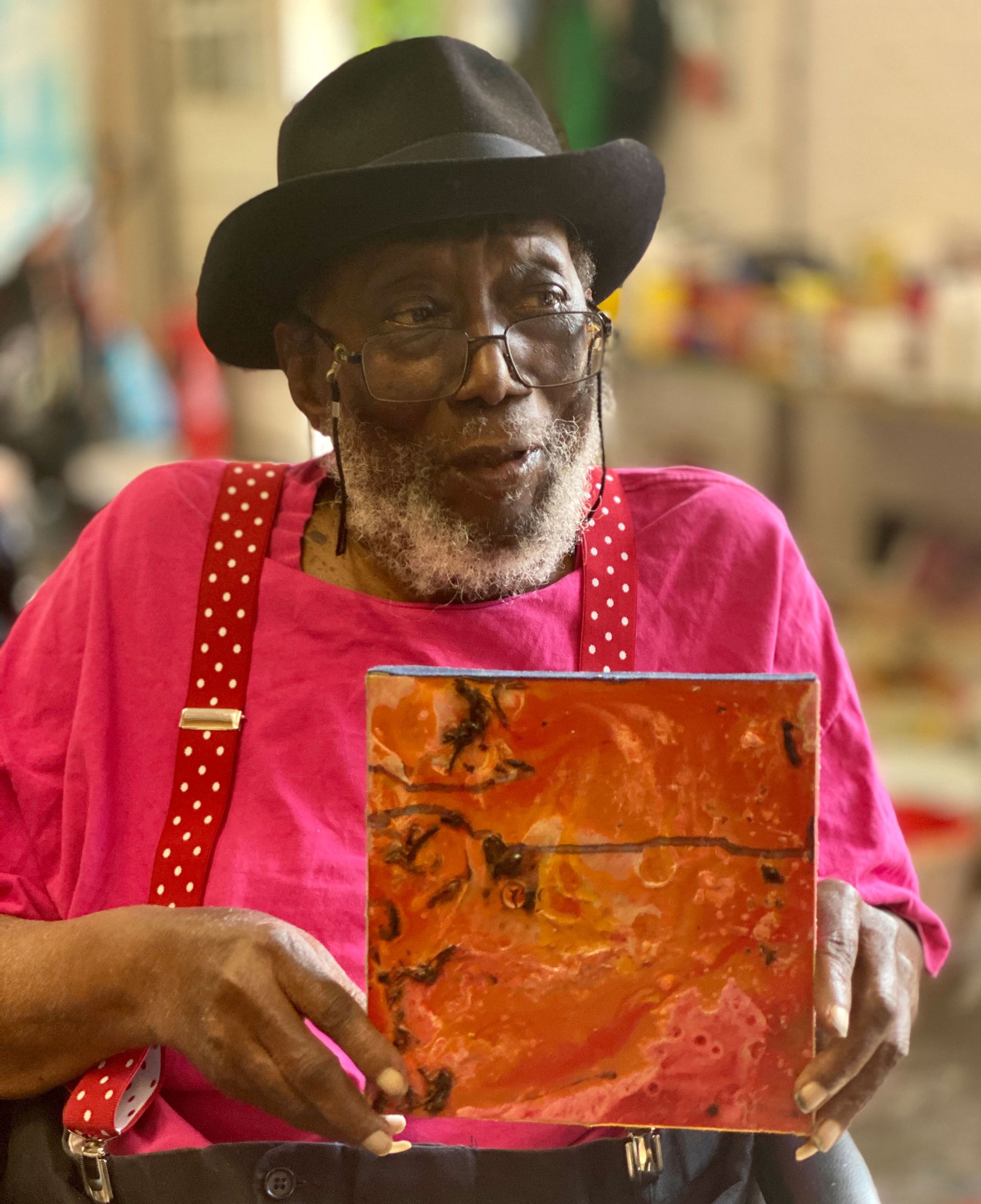 Frank Bowling with his acrylic gel work, Lying Down One, for sale as part of the fourth edition of Cure3 to benefit Parkinson's research. Photo: Ben Bowling. Courtesy of Artwise