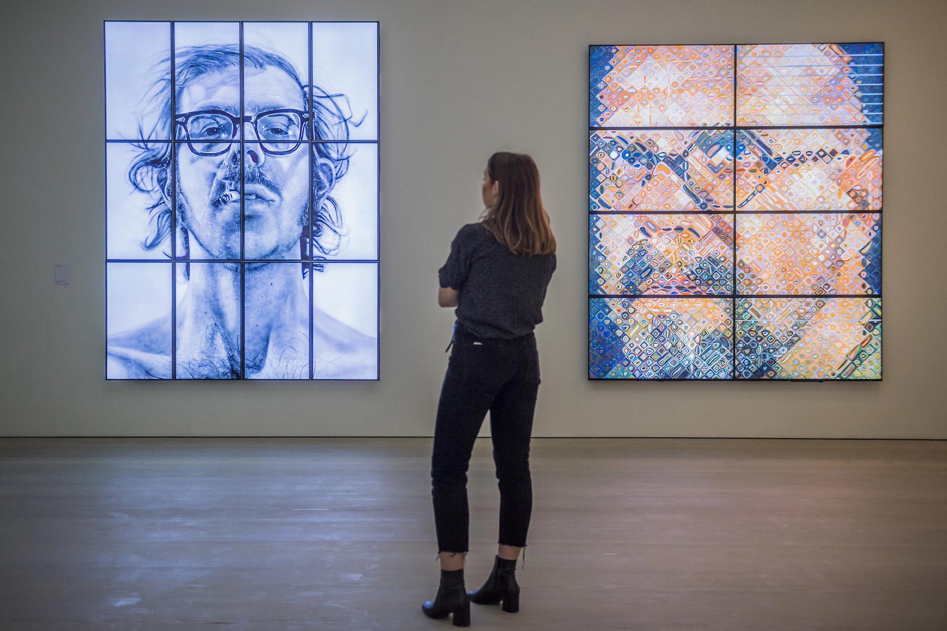A visitor at the preview for the exhibition Self Portraits by Chuck Close: From Selfie to Self-Expression at the Saatchi Gallery, London Rex Features via AP Images