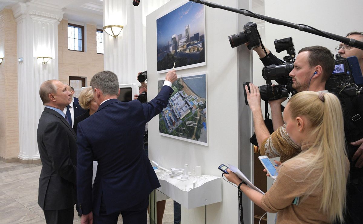Russian president Vladimir Putin and local officials examine plans for one of the regional cultural centres in 2019 Kremlin.ru