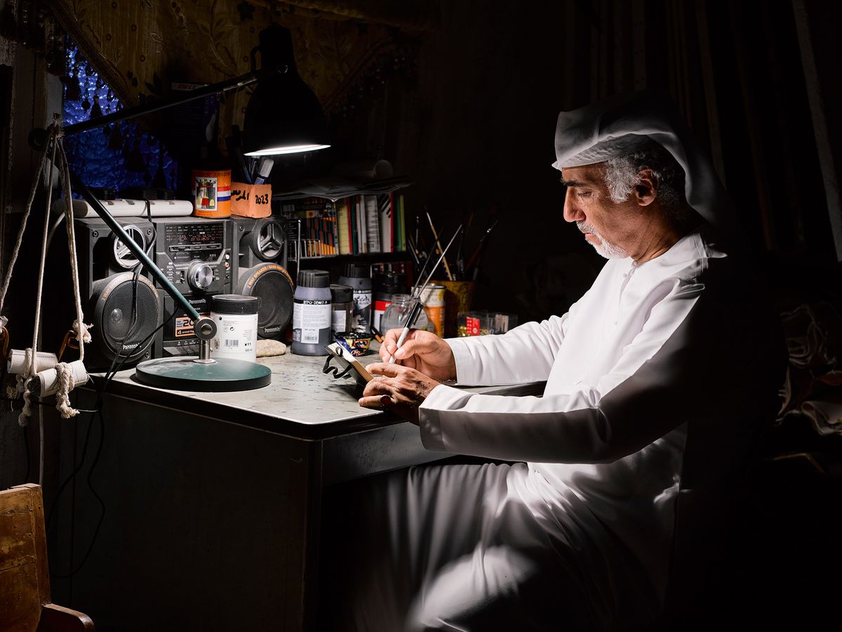 Abdullah Al Saadi at work in his studio; his Biennale show will include drawings, paintings and scrolls Photo: Roman Mensing; courtesy of the National Pavilion UAE