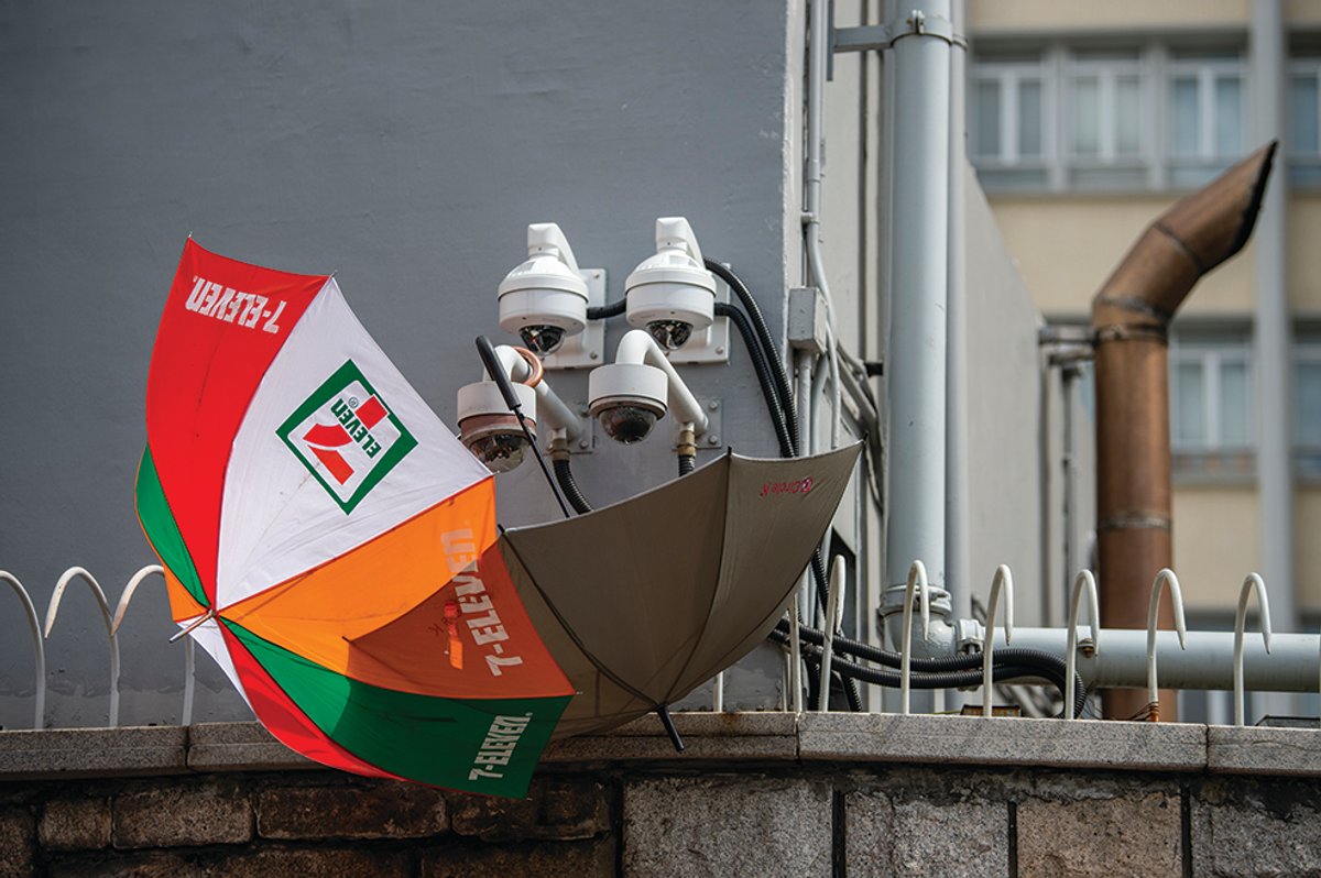 Umbrellas block CCTV cameras as protesters surround Hong Kong's police headquarters Photo: Vernon Yuen/NurPhoto via Getty Images
