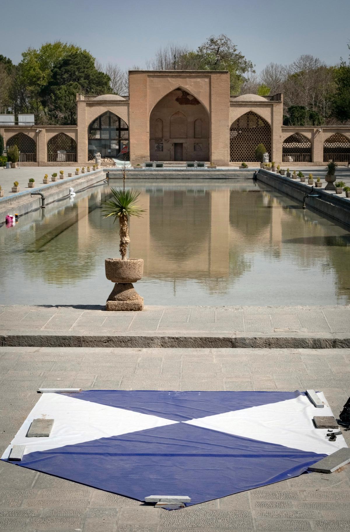The blue-and-white shield sign, officially known as the Blue Shield, installed outside the historic Chehel Sotoun Palace in Isfahan, Iran, on 11 March. The palace was damaged by the force of an explosion wave from an airstrike during the US-Israeli military campaign in Iran Photo: Morteza Nikoubazl/NurPhoto via Getty Images