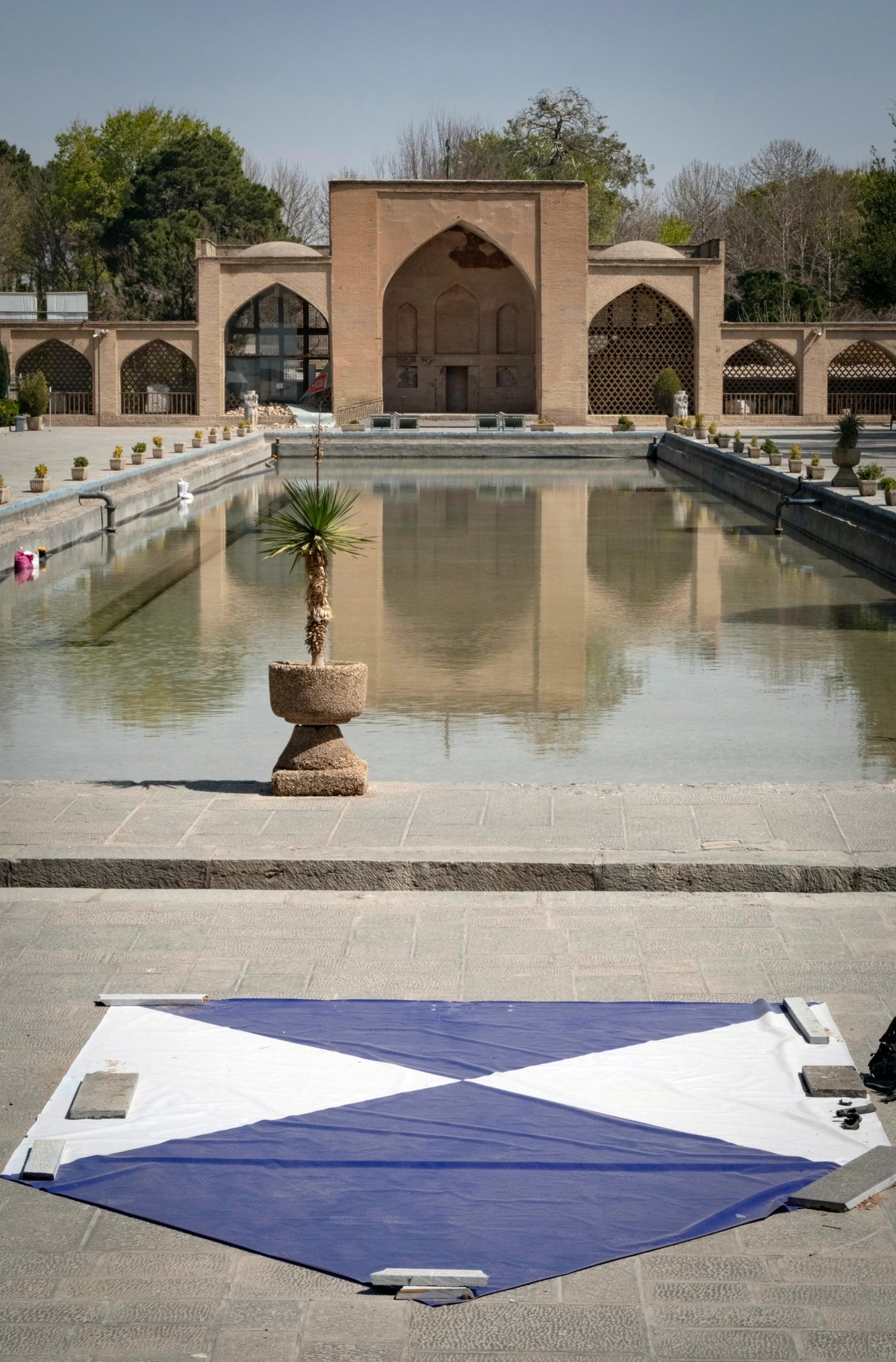 The blue-and-white shield sign, officially known as the Blue Shield, installed outside the historic Chehel Sotoun Palace in Isfahan, Iran, on 11 March. The palace was damaged by the force of an explosion wave from an airstrike during the US-Israeli military campaign in Iran Photo: Morteza Nikoubazl/NurPhoto via Getty Images