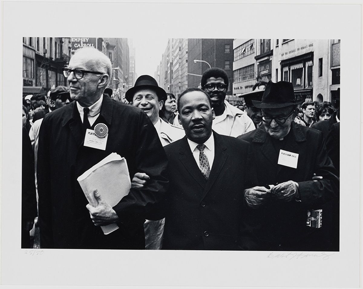 In this 1967 photograph by Benedict J. Fernandez, Dr. Benjamin Spock, Dr. King and Monsignor Rice of Pittsburgh march in the Solidarity Day Parade at the United Nations building on 15 April, 1967 Benedict J. Fernandez/Museum of the City of New York