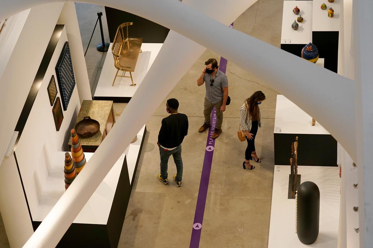 Visitors to this year's scaled-down Design Miami/ fair at the Moore Building cluster along lines encouraging social distancing. AP Images