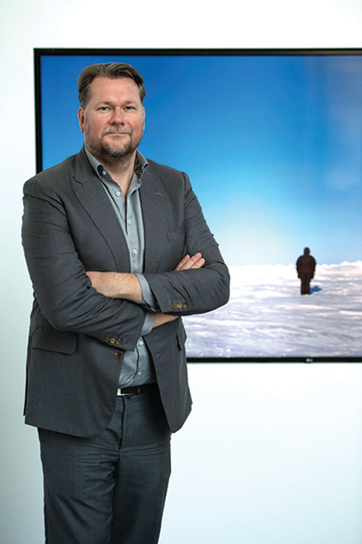 Collector Markus Hannebauer stands in front of a video project by Guido van der Werve in his private museum Fluentum © Lisa Ducret/dpa/Alamy Live News