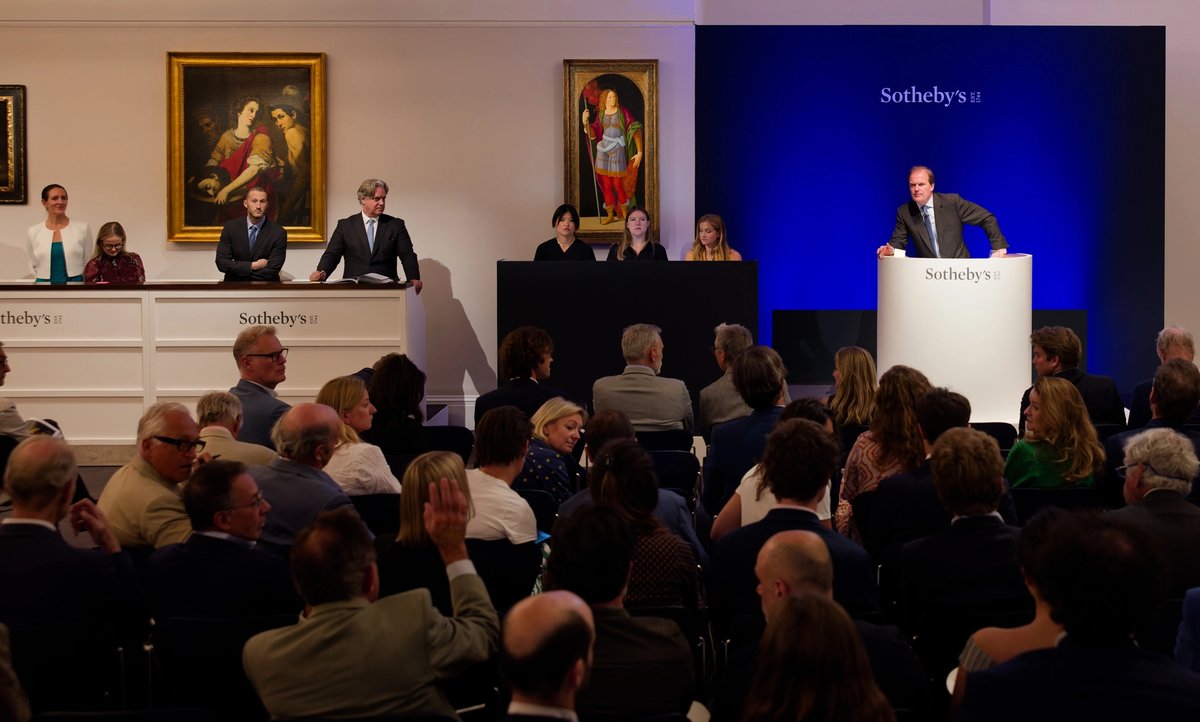 Harry Dalmeny on the rostrum at Sotheby's, with the Lorenzo di Credi and Diana de Rosa in the background
Courtesy Sotheby's