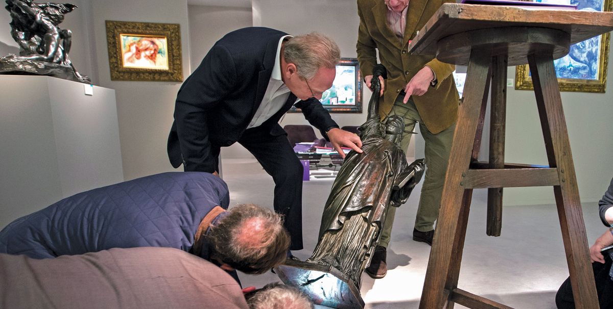 Vetters assess a work at Tefaf. Their exhaustive work is made easier by the high quality of works at the fair. Harry Heuts Photography