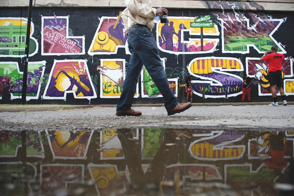 This mural in Tulsa’s Greenwood District marks the Black Wall Street massacre of 1921, where artists now have studios through the Tulsa Artist Fellowship © Brendan Smialowski/AFP via Getty