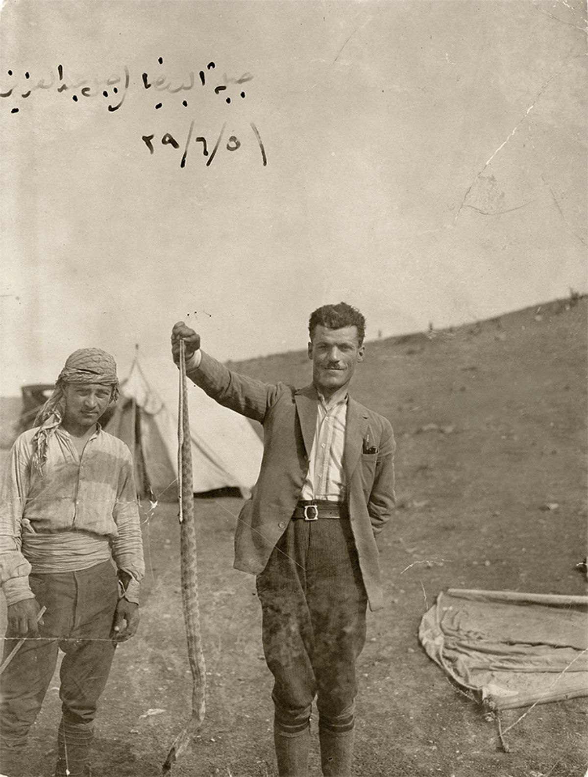 The artist Rayyane Tabet's great-grandfather, Faek Borkhoche, holding a snake in Tell Halaf The Metropolitan Museum of Art