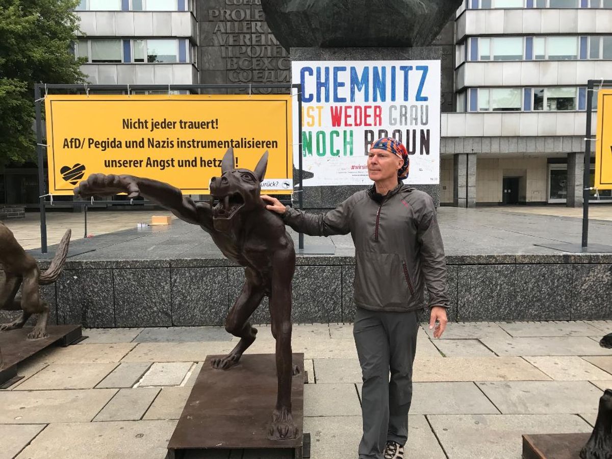 Rainer Opolka with his wolf statue in Chemnitz Courtesy of the artist