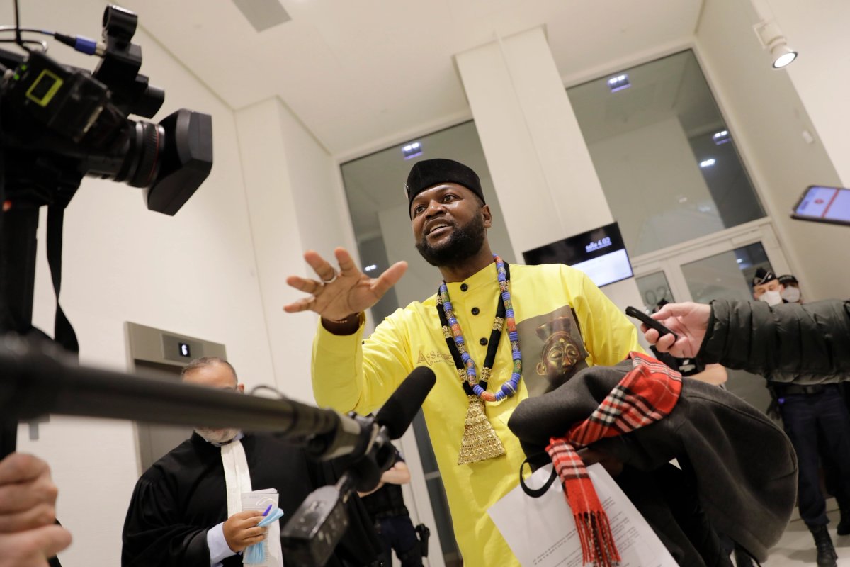 Congo-born Emery Mwazulu Diyabanza speaks to reporters after today's verdict at the Paris Palace of Justice AP Photo/Lewis Joly
