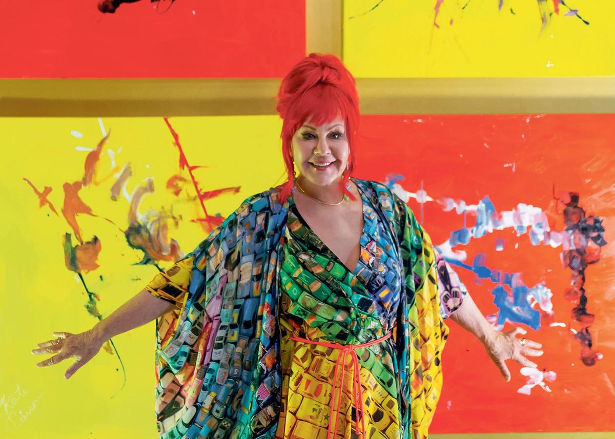 Kate Pierson, singer with the 1980s band the B-52s, with one of the works on show at the Spectrum Miami art fair that were jointly created by band members and a group of chimps. “Boy, can some of those chimps paint!” Pierson said modestly Save The Chimps