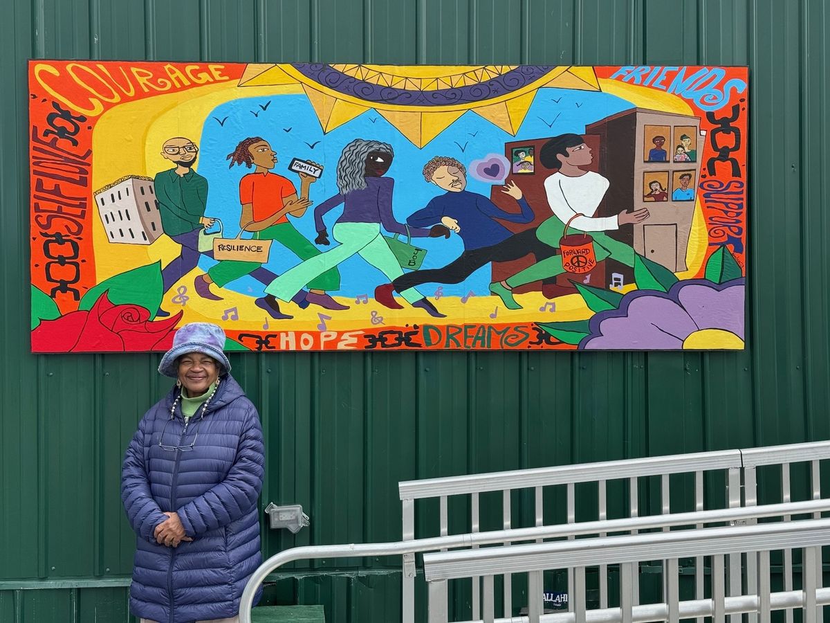 Dindga McCannon in front of her new mural at Rikers Island Photo: Ellie Epstein