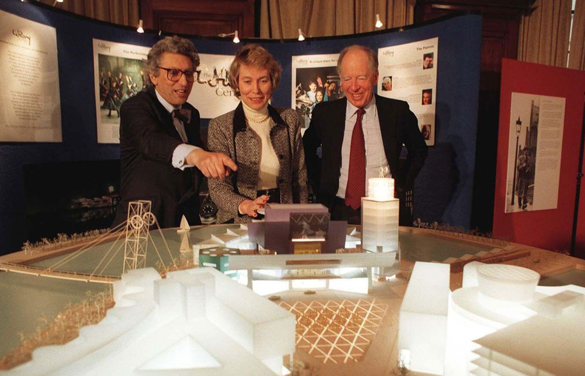 Jacob Rothschild (right) with Grey Gowrie (left), chairman of the Arts Council, and Virginia Bottomley, Secretary of State for National Heritage, inspecting a model for the development of the Lowry Centre, in Salford, Manchester, February 1996. The scheme for the centre—which opened in 2000—was awarded £7.65 million by the Heritage Lottery Fund in 1995-96 under Rothschild's chairmanship John Stilwell / PA Images / Alamy Stock Photo