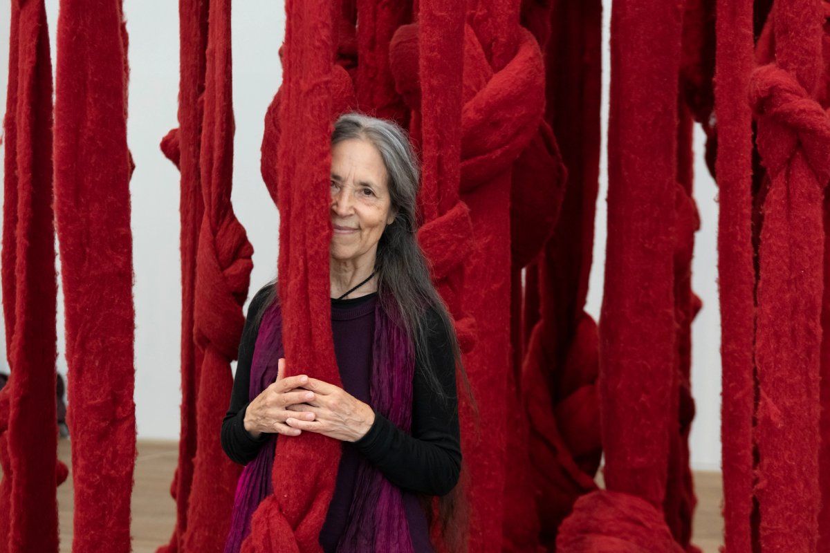 Cecilia Vicuña in front of her work Quipu Womb (2017) at Tate Modern, 2022 © Cecilia Vicuña; Photo: Lucy Dawkins