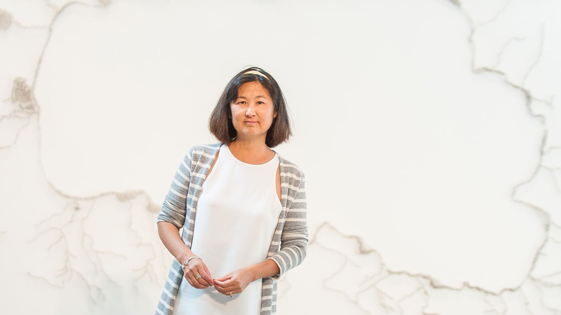Maya Lin with her work Pin River— Tahoe Watershed (2014) in the Nevada Museum of Art 