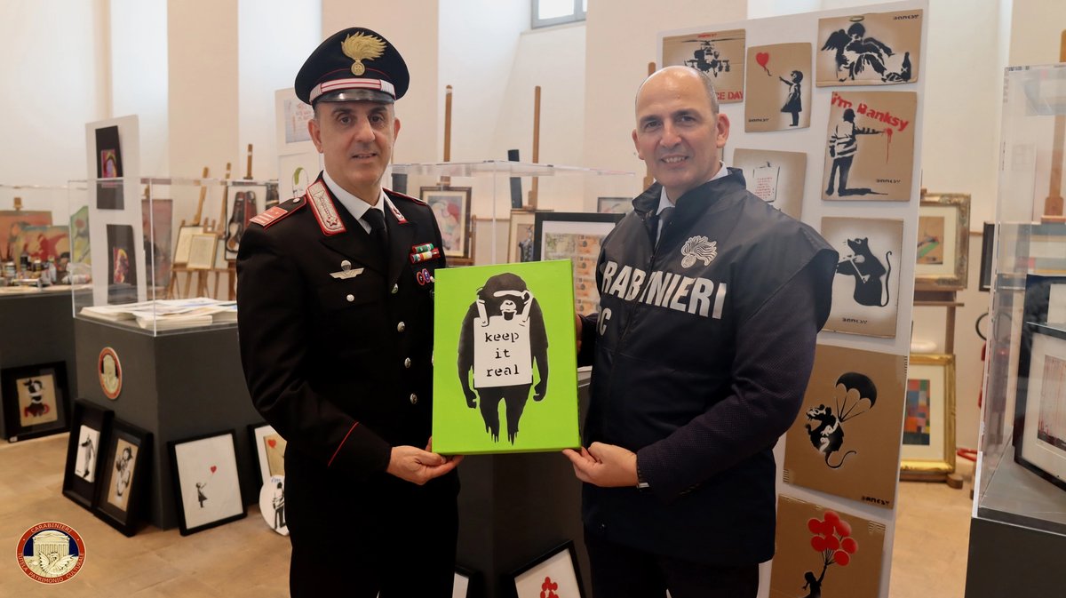 Carabinieri with one of the seized Banksys © Carabinieri - Cultural Heritage Protection Command