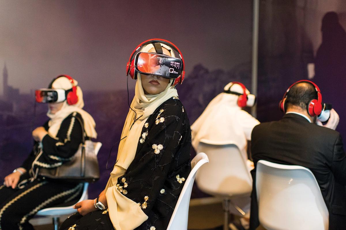 Visitors watch the Reframe Saudi VR film at the fair Rogue Visuals FZ LLE 2018—Christopher Pike, all rights reserved