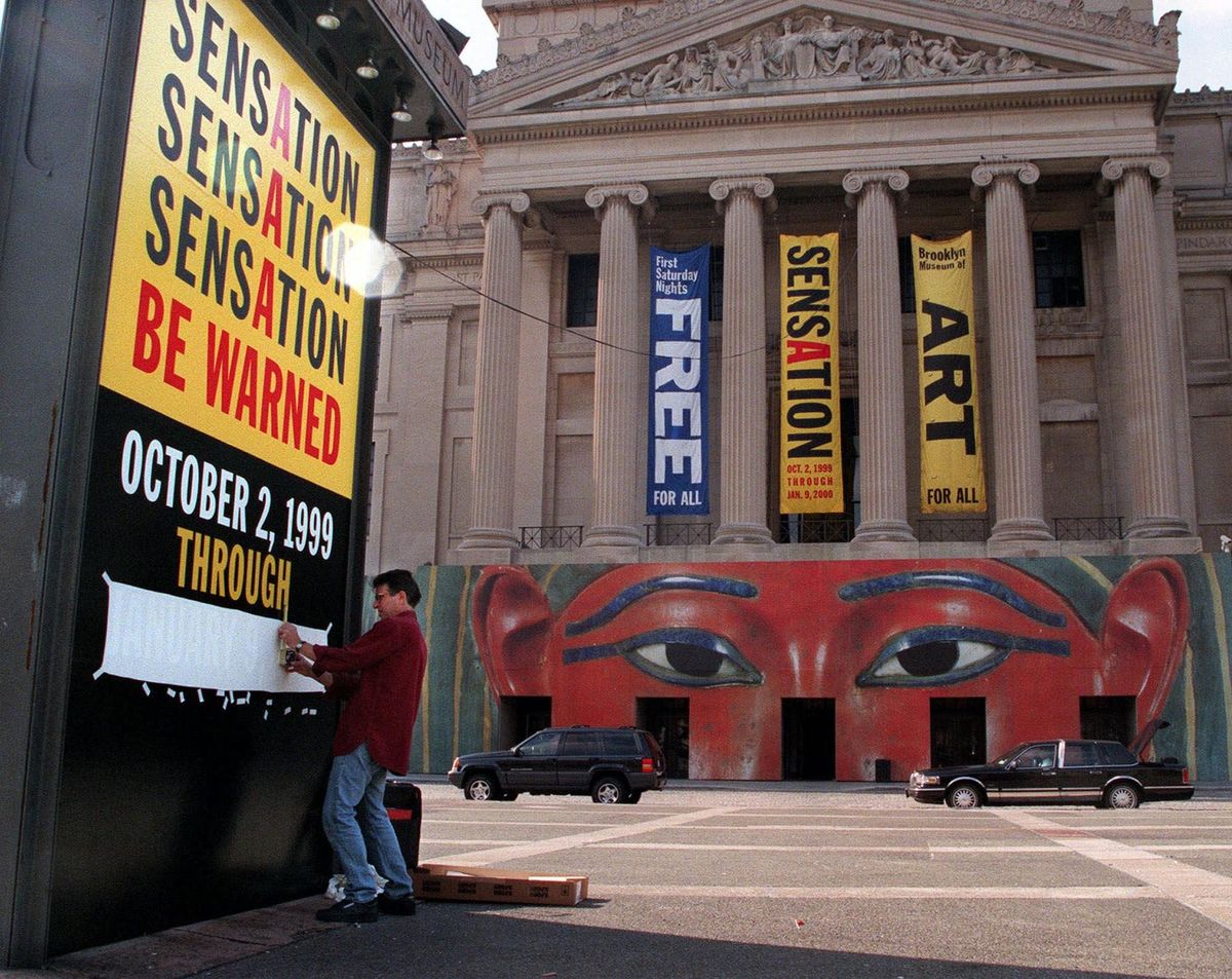 David Ravitch puts the finishing touches on the sign for the controversial art exhibit "Sensation" at the Brooklyn Museum of Art Monday, Sept. 27, 1999, in New York AP Photo/Diane Bondareff / AP Images